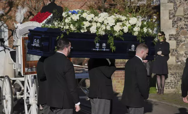 Pallbearers carry the coffin into the funeral service of One Direction singer Liam Payne at St Mary's Church in Amersham, England, Wednesday, Nov. 20, 2024. (Jonathan Brady/PA via AP)