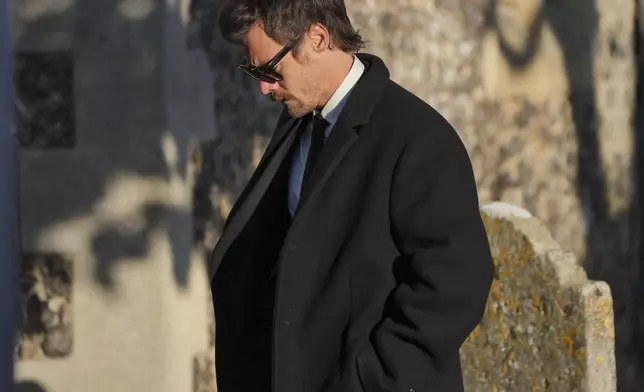 Former One Direction band member Harry Styles walks after the funeral service of One Direction singer Liam Payne at St Mary's Church in Amersham, England, Wednesday, Nov. 20, 2024. (Jonathan Brady/PA via AP)