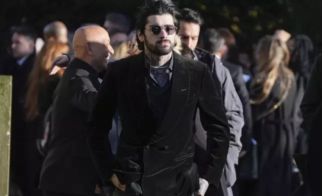 Zayn Malik walks after the funeral service for One Direction singer Liam Payne at St Mary's Church in Amersham, England, Wednesday, Nov. 20, 2024. (Andrew Matthews/PA via AP)