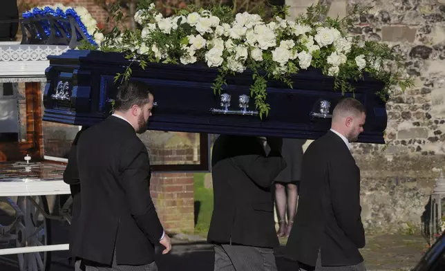Pallbearers carry the coffin into the funeral service of One Direction singer Liam Payne at St Mary's Church in Amersham, England, Wednesday, Nov. 20, 2024. (Jonathan Brady/PA via AP)