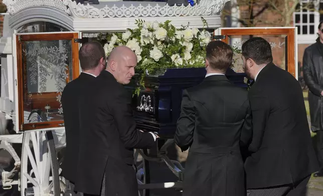 Pallbearers carry the coffin into the funeral service of One Direction singer Liam Payne at St Mary's Church in Amersham, England, Wednesday, Nov. 20, 2024. (Jonathan Brady/PA via AP)