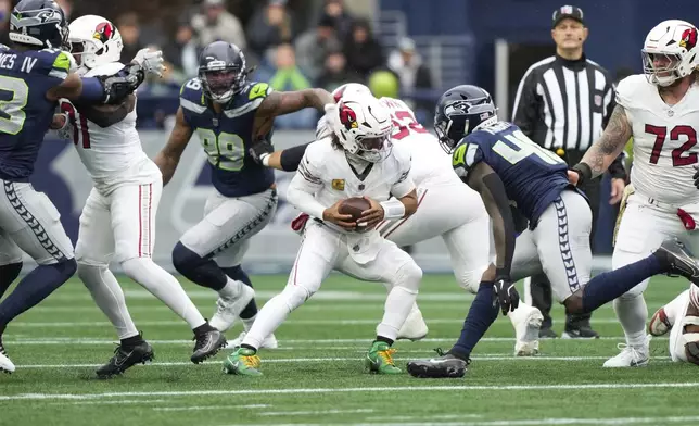 Arizona Cardinals quarterback Kyler Murray (1) scrambles during the first half of an NFL football game against against the Seattle Seahawks, Sunday, Nov. 24, 2024, in Seattle. (AP Photo/Stephen Brashear)