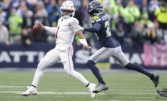 Arizona Cardinals quarterback Kyler Murray (1) looks to throw during the second half of an NFL football game against the Seattle Seahawks, Sunday, Nov. 24, 2024, in Seattle. Seattle Seahawks cornerback Coby Bryant intercepted the throw. (AP Photo/Jason Redmond)