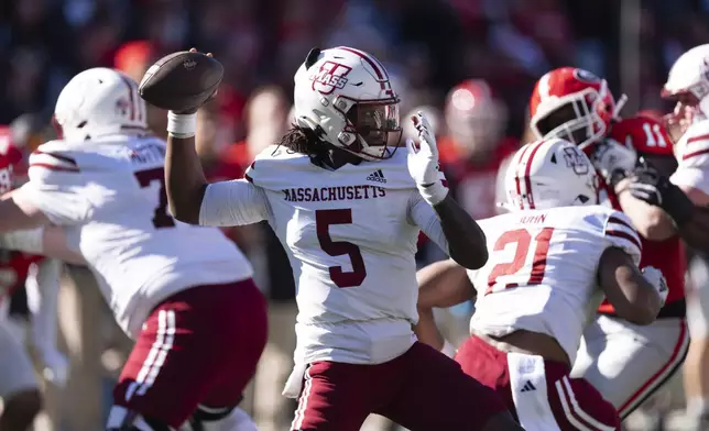 UMass quarterback Ahmad Haston (5) throw from the pocket during the first half of an NCAA college football game against Georgia, Saturday, Nov. 23, 2024, in Athens, Ga. (AP Photo/John Bazemore)