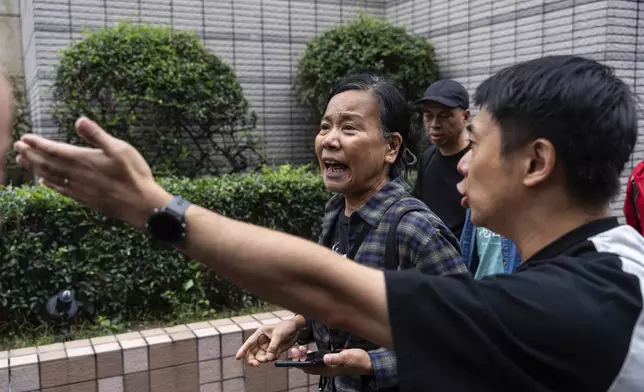 Chan Po-ying, wife of Leung Kwok-hung, one of the defendants in the national security case, leaves the West Kowloon Magistrates' Courts in Hong Kong Tuesday, Nov. 19, 2024, after the sentencing. (AP Photo/Chan Long Hei)