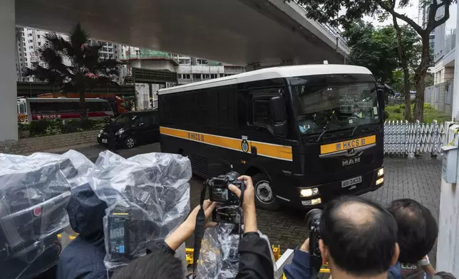 A Correctional Services Department vehicle arrives at the West Kowloon Magistrates' Courts in Hong Kong Tuesday, Nov. 19, 2024, ahead of the sentencing in national security case. (AP Photo/Chan Long Hei)