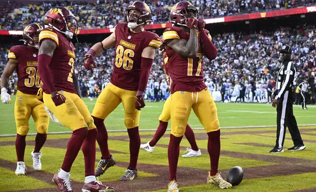 Washington Commanders wide receiver Terry McLaurin (17) celebrates after scoring an 86-yard touchdown during the second half of an NFL football game against the Dallas Cowboys, Sunday, Nov. 24, 2024, in Landover, Md. (AP Photo/Nick Wass)