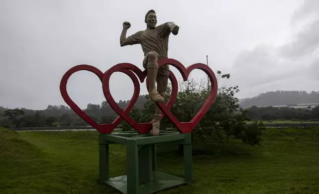 FILE - A statue of Brazilian soccer legend Pele stands on the side of the highway at the entrance to Tres Coracoes, the city where he was born in Brazil, Monday, Dec. 5, 2022. (AP Photo/Bruna Prado, File)