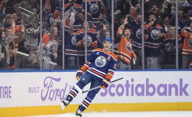 Edmonton Oilers' Darnell Nurse (25) celebrates a goal against the New York Rangers during first period NHL action in Edmonton on Saturday, November 23, 2024. (Jason Franson/The Canadian Press via AP)