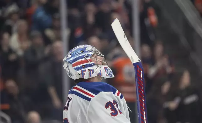 New York Rangers' goalie Jonathan Quick (32) looks to the big screen after being scored on by the Edmonton Oilers during second period NHL action in Edmonton on Saturday, November 23, 2024. (Jason Franson/The Canadian Press via AP)