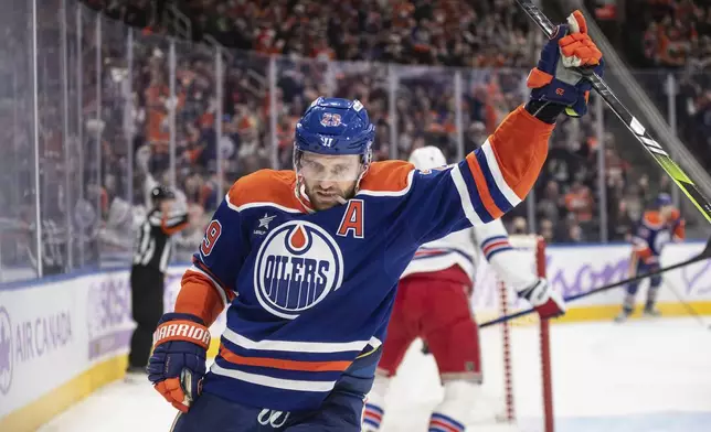 Edmonton Oilers' Leon Draisaitl (29) celebrates a goal against the New York Rangers during second period NHL action in Edmonton on Saturday, November 23, 2024. (Jason Franson/The Canadian Press via AP)