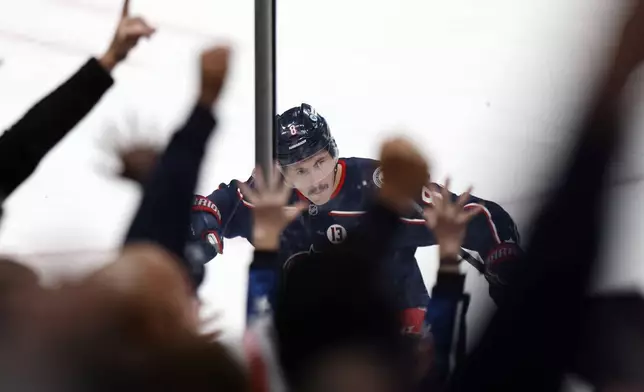 Columbus Blue Jackets defenseman Zach Werenski celebrates his game-winning overtime goal against the Tampa Bay Lightning during an NHL hockey game in Columbus, Ohio, Thursday, Nov. 21, 2024. The Blue Jackets won 7-6. (AP Photo/Paul Vernon)