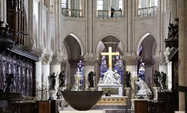 The altar designed by French artist and designer Guillaume Bardet is seen in the heart of Notre-Dame de Paris cathedral while French President Emmanuel Macron visits the restored interiors of the monument, Friday Nov. 29, 2024, in Paris. (Stephane de Sakutin, Pool via AP)