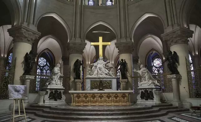 The altar of the Notre-Dame de Paris cathedral is seen while French President Emmanuel Macron visits the restored interiors the monument, Friday, Nov.29, 2024 in Paris. (Christophe Petit Tesson, Pool via AP)