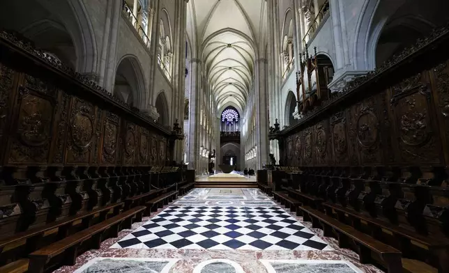 The choir stalls of Notre-Dame de Paris cathedral are seen while French President Emmanuel Macron visits the restored interiors of the monument, Friday Nov. 29, 2024, in Paris. (Stephane de Sakutin, Pool via AP)