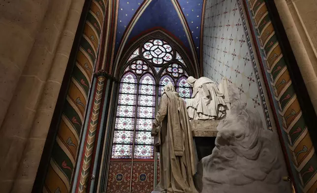 A statue is seen inside Notre-Dame de Paris cathedral while French President Emmanuel Macron visits the restored interiors of the monument, Friday Nov. 29, 2024, in Paris. (Stephane de Sakutin, Pool via AP)