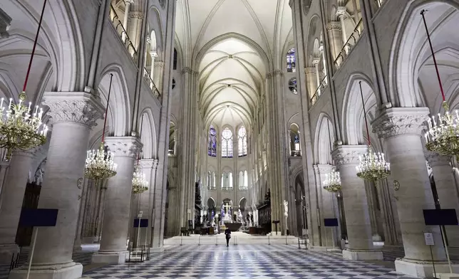 The nave of Notre-Dame de Paris cathedral is seen while French President Emmanuel Macron visits the restored interiors of the cathedral, Friday Nov. 29, 2024, in Paris. (Stephane de Sakutin, Pool via AP)