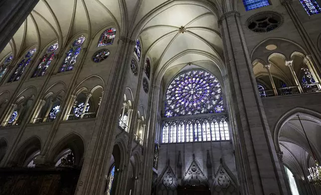 The South Rose stainglass window of Notre-Dame de Paris cathedral is seen while French President Emmanuel Macron visits the restored interiors of the cathedral, Friday Nov. 29, 2024, in Paris. (Stephane de Sakutin, Pool via AP)