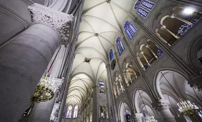 The nave of Notre-Dame de Paris cathedral is seen while French President Emmanuel Macron visits the restored interiors of the cathedral, Friday Nov. 29, 2024, in Paris. (Stephane de Sakutin, Pool via AP)