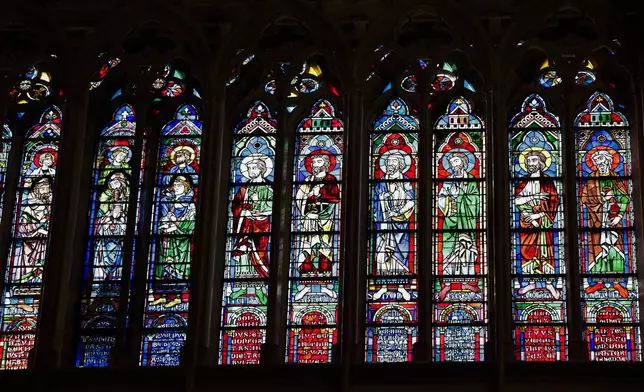 Stained glass windows are seen inside Notre-Dame de Paris cathedral while French President Emmanuel Macron visits the restored interiors of the monument, Friday Nov. 29, 2024, in Paris. (Stephane de Sakutin, Pool via AP)