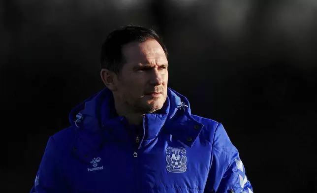 New Coventry City manager Frank Lampard walks, during a training session at the Ryton Training Ground, in Coventry, Thursday, Nov. 28, 2024. (Bradley Collyer/PA via AP)