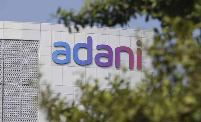 Adani's signage is seen on the facade of Adani's corporate house in Ahmedabad, India, Thursday, Nov. 21, 2024. (AP Photo/Ajit Solanki)