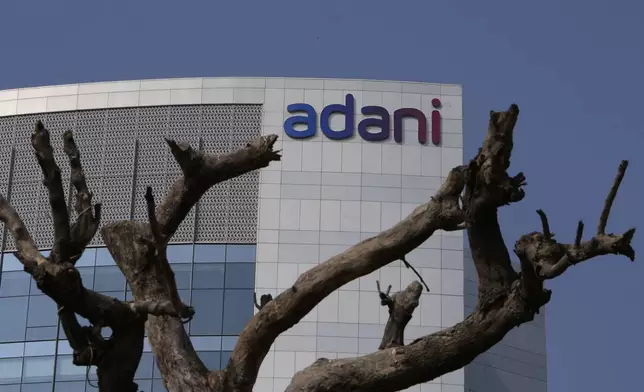 FILE- A tree with dried branches stands outside Adani Corporate House in Ahmedabad, India, Jan. 27, 2023. (AP Photo/Ajit Solanki, File)