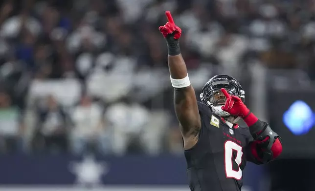 Houston Texans linebacker Azeez Al-Shaair reacts after a play against the Dallas Cowboys during the second half of an NFL football game, Monday, Nov. 18, 2024, in Arlington, Texas. (AP Photo/Tony Gutierrez)