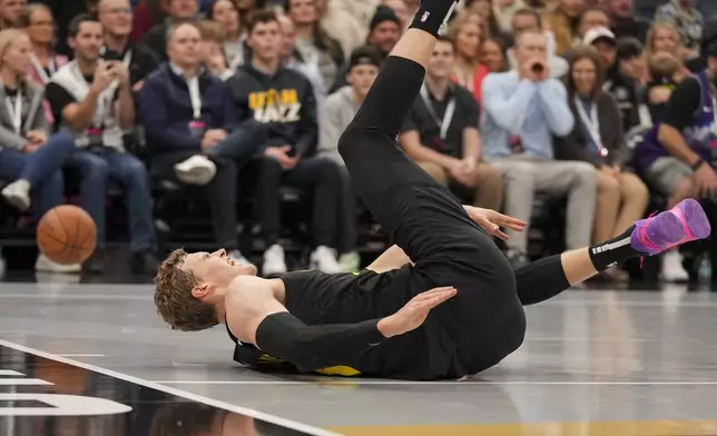 Utah Jazz forward Lauri Markkanen (23) reacts to an injury during the second half of an NBA basketball game against the San Antonio Spurs, on Tuesday, Nov. 26, 2024, in Salt Lake City. (AP Photo/Bethany Baker)