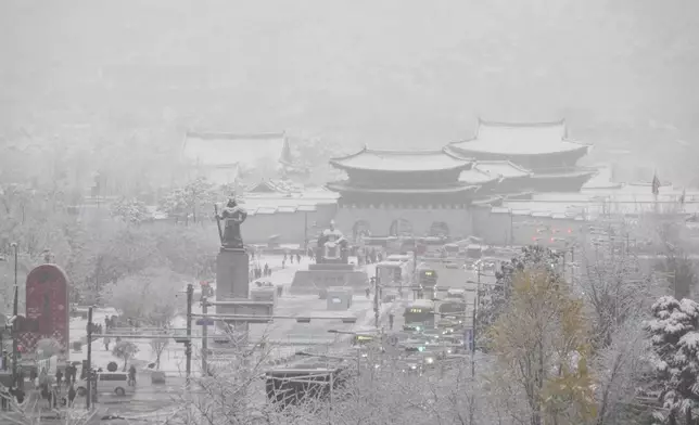 Gwanghwamun Square and Gyeongbok Palace are blanketed with snow in Seoul, South Korea, Wednesday, Nov. 27, 2024. (AP Photo/Ahn Young-joon)