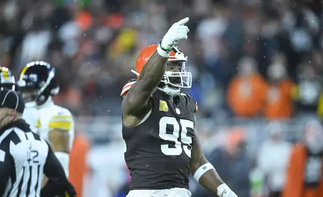 Cleveland Browns defensive end Myles Garrett (95) reacts after a defensive stop in the first half of an NFL football game against the Pittsburgh Steelers, Thursday, Nov. 21, 2024, in Cleveland. (AP Photo/David Richard)