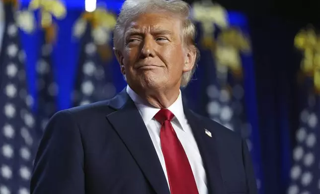 Republican presidential nominee former President Donald Trump arrives at an election night watch party at the Palm Beach Convention Center, Wednesday, Nov. 6, 2024, in West Palm Beach, Fla. (AP Photo/Evan Vucci)