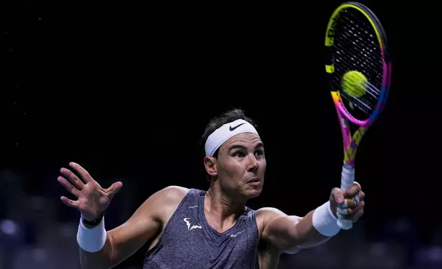 Spain's tennis player Rafael Nadal returns the ball during a training session at the Martin Carpena Sports Hall, in Malaga, southern Spain, on Saturday, Nov. 16, 2024. (AP Photo/Manu Fernandez)