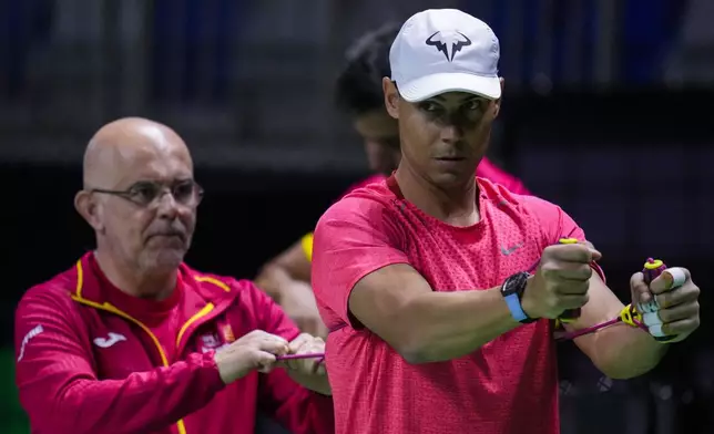 Spain's Rafael Nadal takes part in a training session at the Martin Carpena Sports Hall, in Malaga, southern Spain, on Friday, Nov. 15, 2024. (AP Photo/Manu Fernandez)