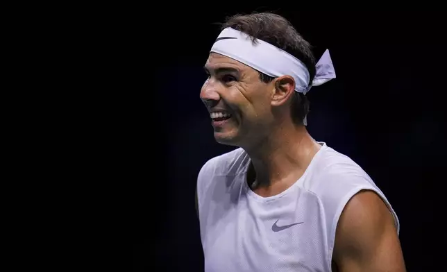 Spain's tennis player Rafael Nadal smiles during a training session at the Martin Carpena Sports Hall, in Malaga, southern Spain, on Saturday, Nov. 16, 2024. (AP Photo/Manu Fernandez)