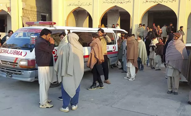 Relatives gather to collect the body of a person who was killed when gunmen fired on vehicles carrying Shiite Muslims Thursday, at a hospital in Parachinar, main town of Kurram district of Pakistan's northwestern Khyber Pakhtunkhwa province, Friday, Nov. 22, 2024. (AP Photo/Hussain Ali)