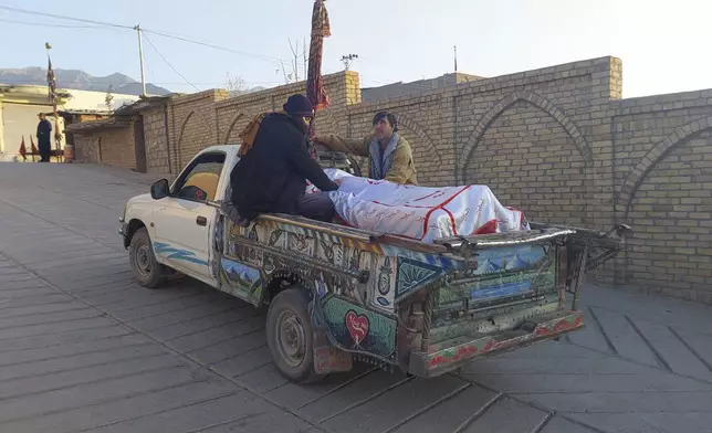 Relatives transport the body of a victim of a gunmen firing incident, after collecting it from a hospital, in Parachinar, main town of Kurram district of Pakistan's northwestern Khyber Pakhtunkhwa province, Friday, Nov. 22, 2024. (AP Photo/Hussain Ali)