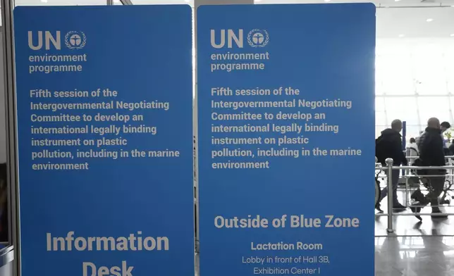 Signboards are displayed at the venue for the fifth session of the Intergovernmental Negotiating Committee on Plastic Pollution in Busan, South Korea, Friday, Nov. 29, 2024. (AP Photo/Ahn Young-joon)