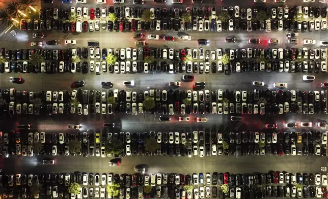 An aerial view shows a packed parking lot at Citadel Outlets in Commerce, Calif., Thursday, Nov. 28, 2024, as early Black Friday shoppers arrive at the mall. (AP Photo/Jae C. Hong)