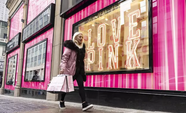 Shoppers take advantage of Black Friday deals in Montreal on Friday, Nov. 29, 2024. (Christinne Muschi /The Canadian Press via AP)