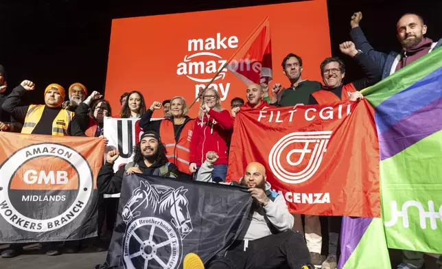 To mark the Black Friday discount day, around 400 to 500 Amazon employees from Germany joined colleagues from the USA, Sweden, the UK and Italy at the international protest center in Bad Hersfeld,Germany, and took part in the central strike meeting in the Schilde Hall, Friday, Nov. 29, 2024. (Christian Lademann/dpa via AP)