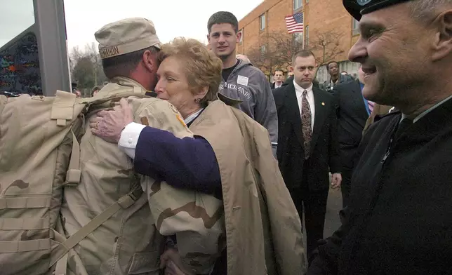 FILE - Connecticut Gov. M. Jodi Rell hugs Maj. Kevin McMahon, of Old Lyme, Conn., after he and other members of the 118th Medical Battalion of the Connecticut National Guard arrived home in Newington, Conn., Feb. 10, 2005. (AP Photo/Bob Child, File)