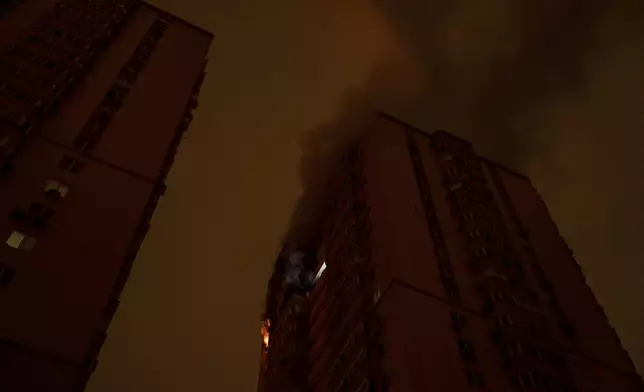 Flames and smoke rise from a residential building after the attack of Russian drones in Kyiv, Ukraine, Friday, Oct. 26, 2024. (AP Photo/Alex Babenko)