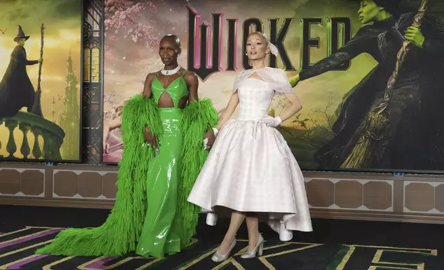 Cynthia Erivo, left, and Ariana Grande arrive at the premiere of "Wicked" on Saturday, Nov. 9, 2024, at Dorothy Chandler Pavilion in Los Angeles. In “Wicked,” Elphaba and Glinda travel from Shiz University to the Emerald City on a glistening green train to meet the wizard. In real life, Cynthia Erivo and Ariana Grande have traveled much farther and wider and longer and on airplanes to promote their hotly anticipated film. (Photo by Jordan Strauss/Invision/AP)