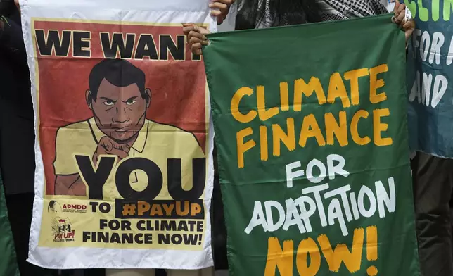 Activists participate in a demonstration for climate finance at the COP29 U.N. Climate Summit, Thursday, Nov. 14, 2024, in Baku, Azerbaijan. (AP Photo/Peter Dejong)