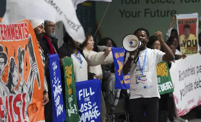 Activists participate in a demonstration calling for climate finance during the COP29 U.N. Climate Summit, Thursday, Nov. 14, 2024, in Baku, Azerbaijan. (AP Photo/Peter Dejong)