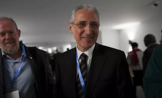 Mukhtar Babayev, COP29 President, walks through the COP29 U.N. Climate Summit, Thursday, Nov. 14, 2024, in Baku, Azerbaijan. (AP Photo/Peter Dejong)