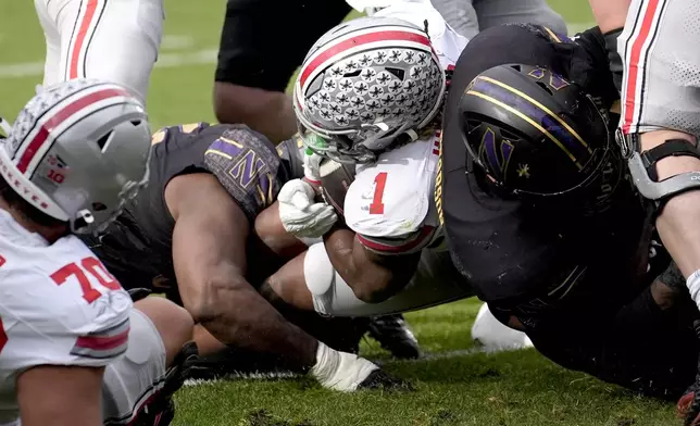 Ohio State running back Quinshon Judkins (1) scores during the first half of an NCAA college football game against Northwestern at Wrigley Field on Saturday, Nov. 16, 2024, in Chicago. (AP Photo/Charles Rex Arbogast)