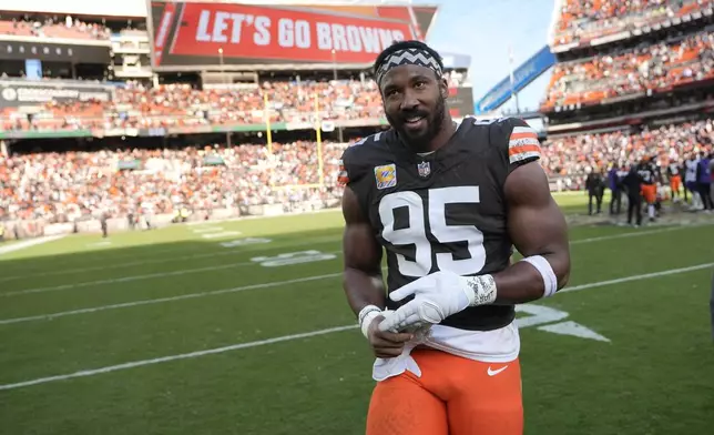 Cleveland Browns defensive end Myles Garrett (95) smiles as he come off the field following a game against the Baltimore Ravens in an NFL football game in Cleveland, Sunday, Oct. 27, 2024. (AP Photo/Sue Ogrocki)