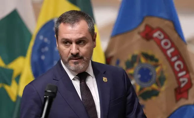 Federal police director Andrei Passos arrives to a news conference regarding an explosion outside the Supreme Court, in Brasilia, Brazil, Thursday, Nov. 14, 2024. (AP Photo/Eraldo Peres)